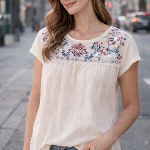 White boho-style blouse with beautiful multicolor floral embroidery